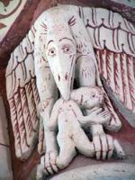 Chauvigny, Eglise Saint-Pierre, Chapiteau, Oiseau fantastique devorant un homme